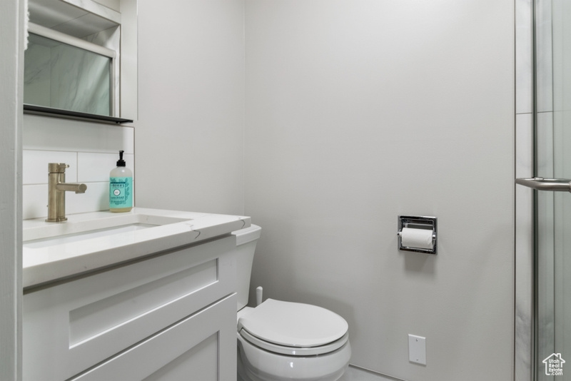 Bathroom with vanity and an enclosed shower
