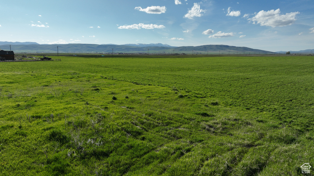 View of mountain background featuring rural landscape