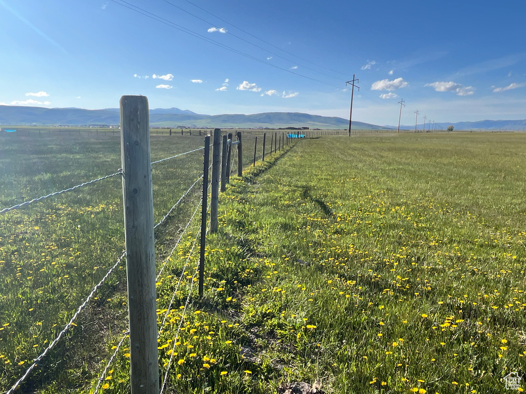 View of yard with a view of countryside and a mountain view