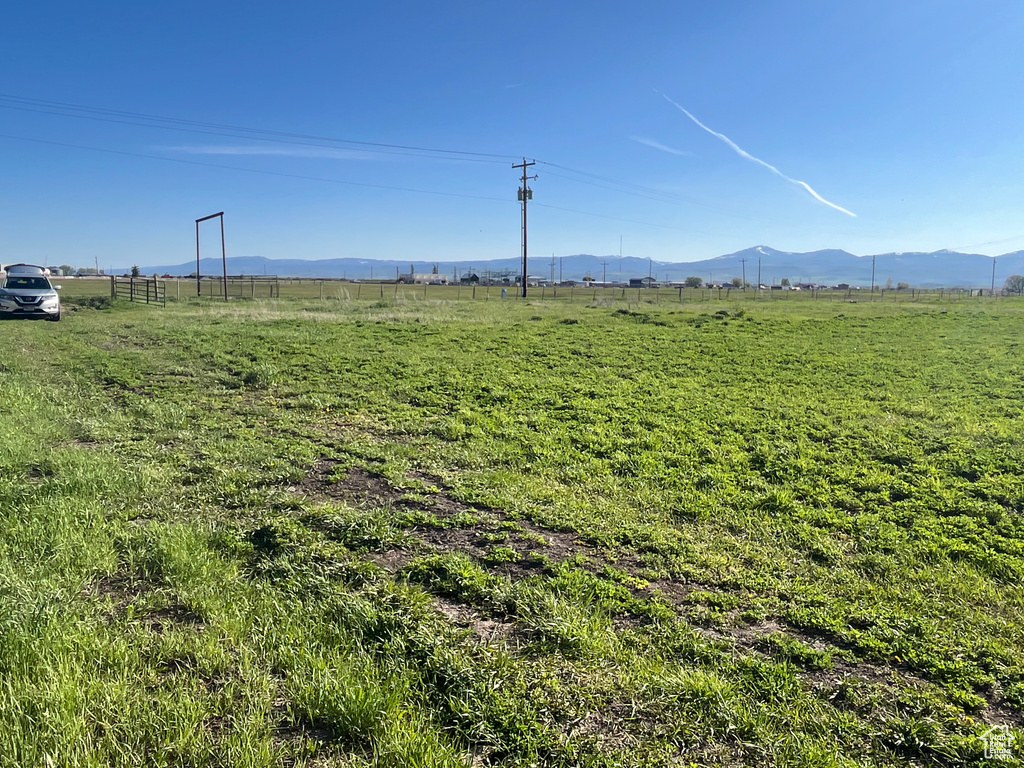 View of yard with a view of countryside and a mountain view