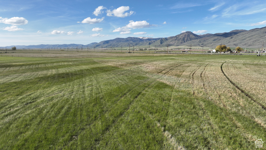 View of mountain backdrop featuring rural landscape