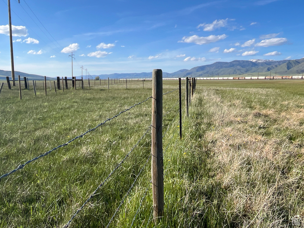 View of yard with a view of rural / pastoral area and a mountain view
