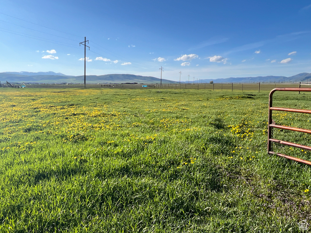 View of mountain backdrop with rural landscape and a pastoral area