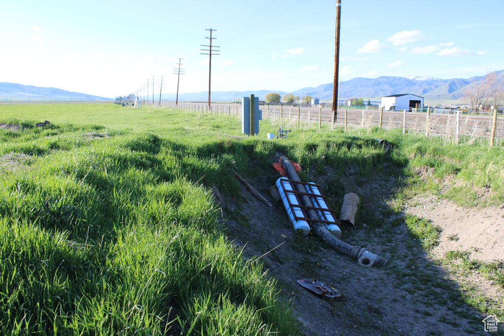 View of yard featuring a view of rural / pastoral area and a mountain view