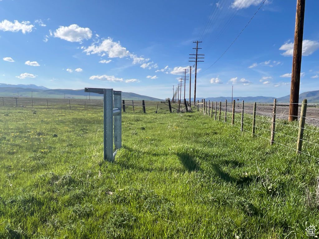 View of yard featuring a view of countryside and a mountain view