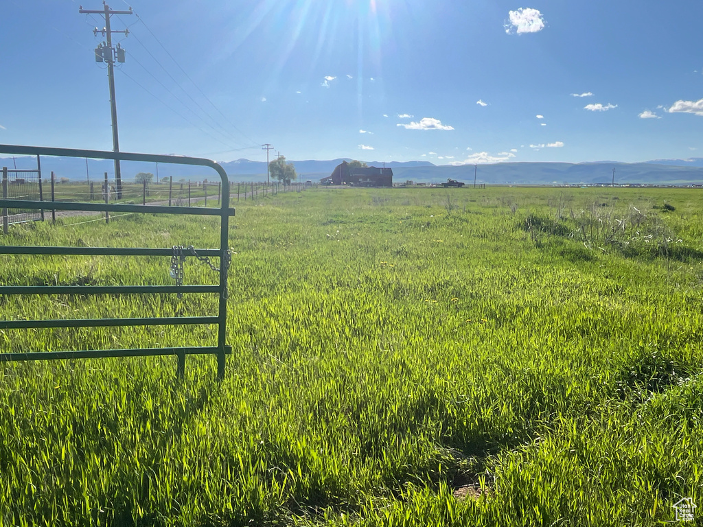 View of yard featuring a view of countryside and a mountain view