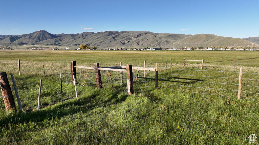 View of mountain background featuring rural landscape