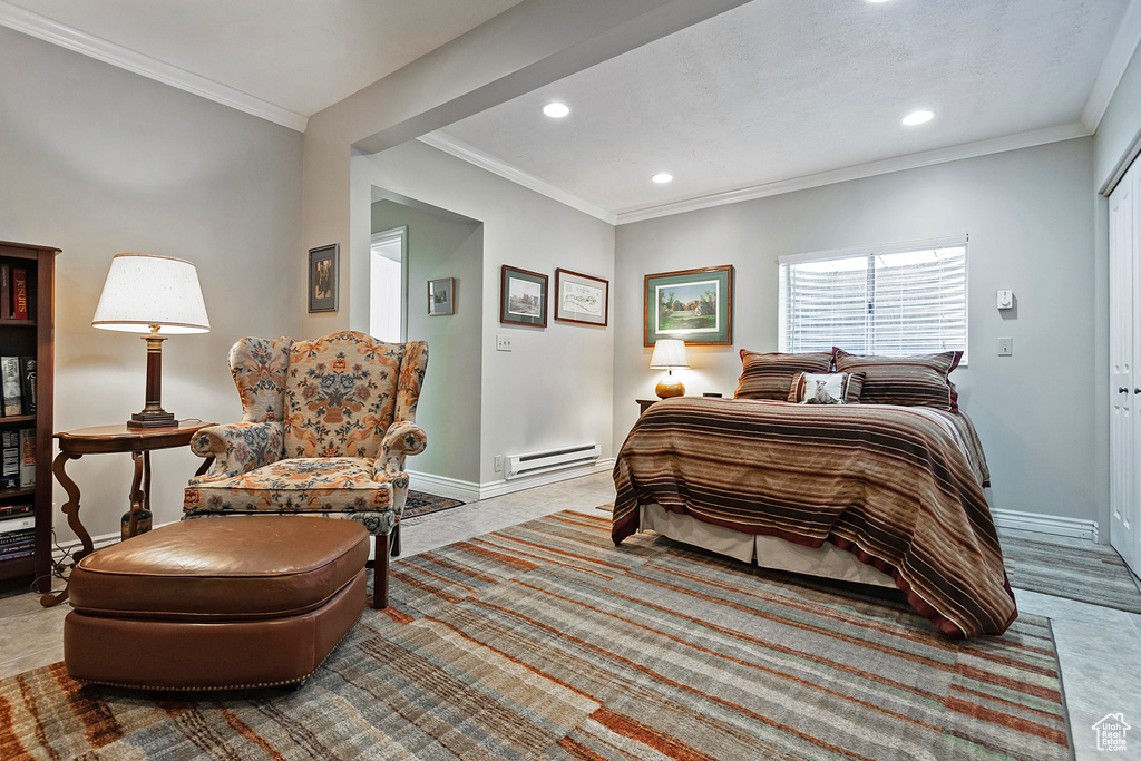 Bedroom featuring recessed lighting, baseboards, crown molding, and a baseboard radiator
