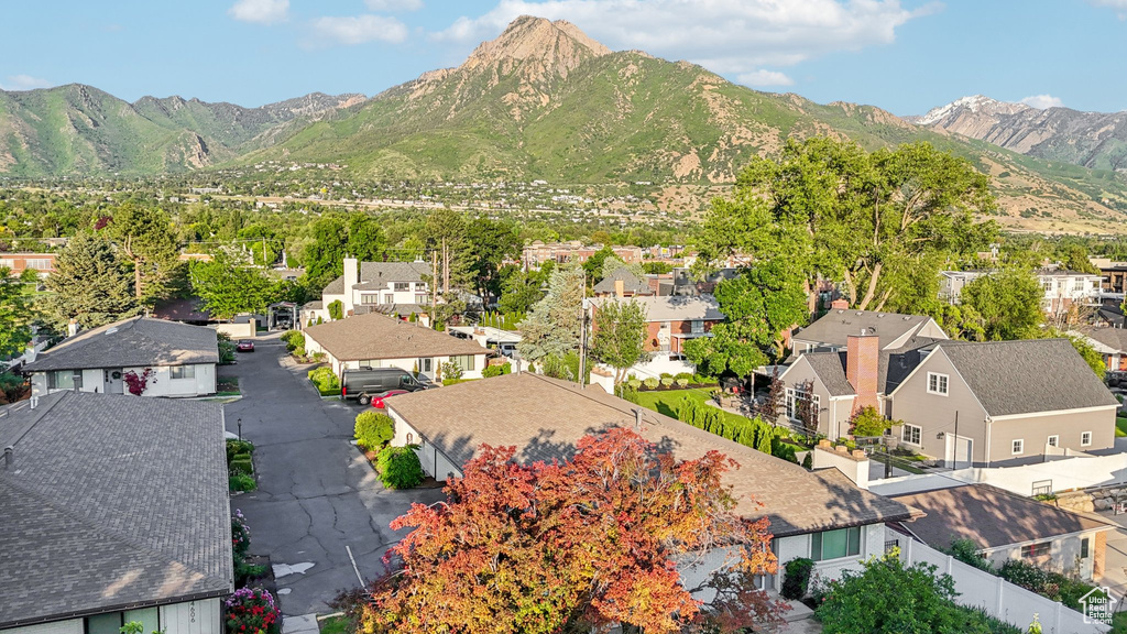 View of mountain backdrop featuring nearby suburban area