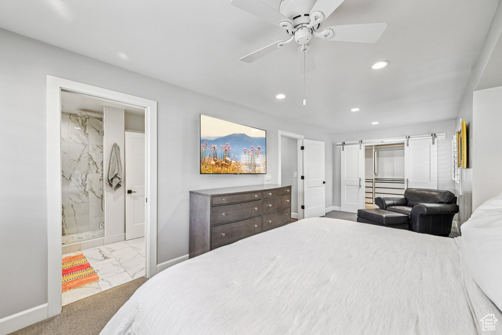 Bedroom featuring marble finish floors, a barn door, baseboards, recessed lighting, and ceiling fan