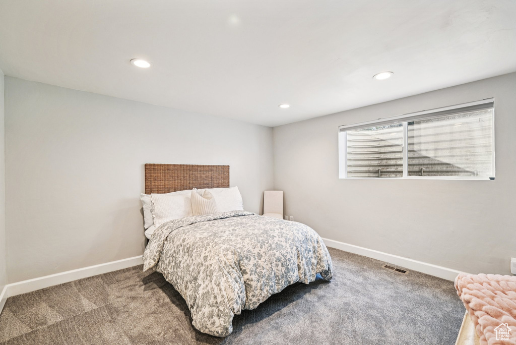 Bedroom featuring carpet, baseboards, and recessed lighting