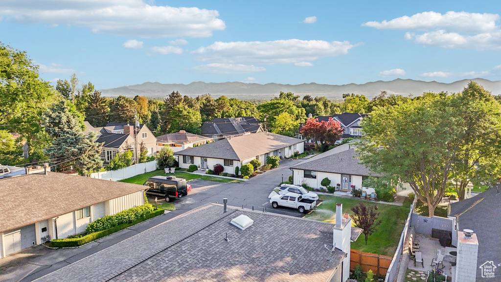 Aerial perspective of suburban area featuring a mountain backdrop