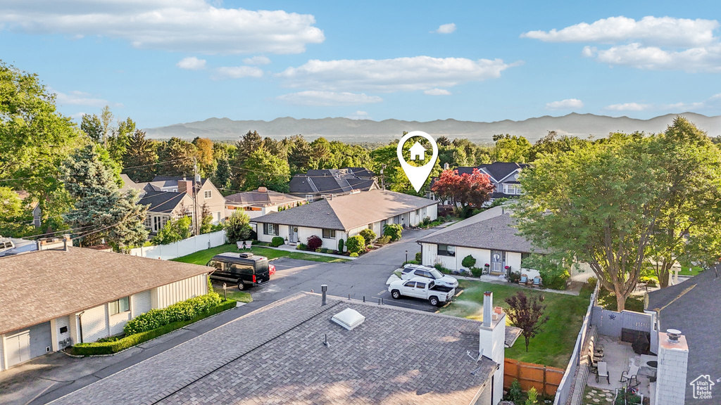 Aerial view of residential area featuring a mountain backdrop