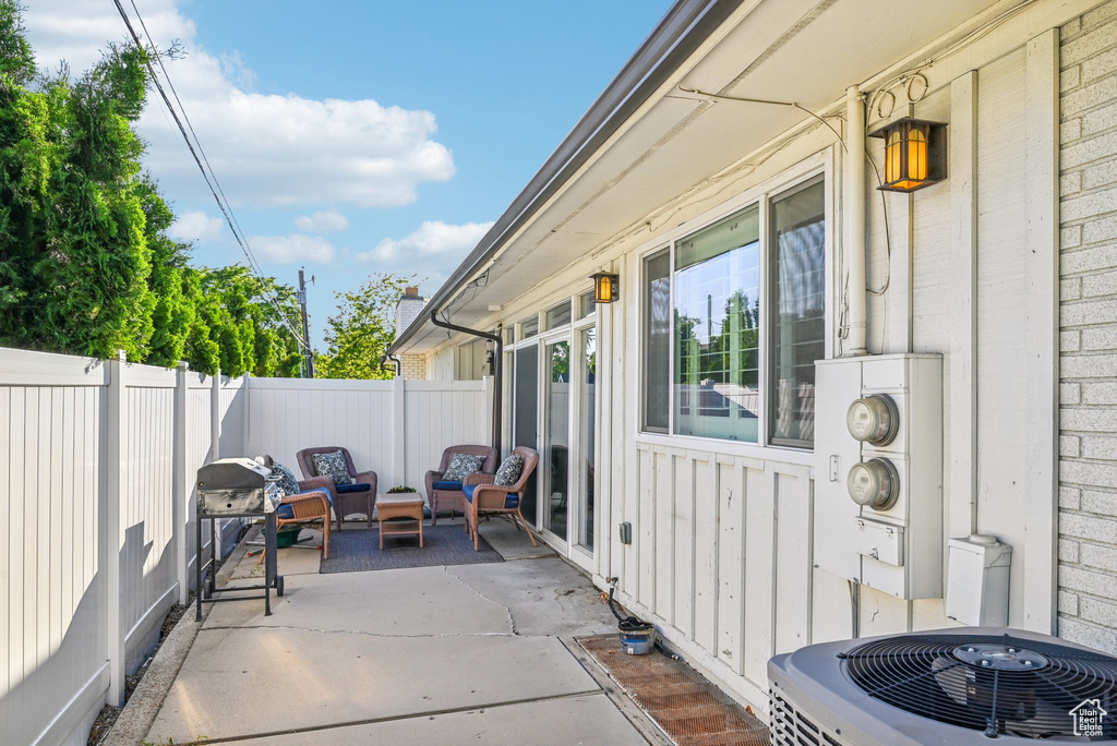 Fenced backyard with central AC, a patio, outdoor lounge area, and area for grilling