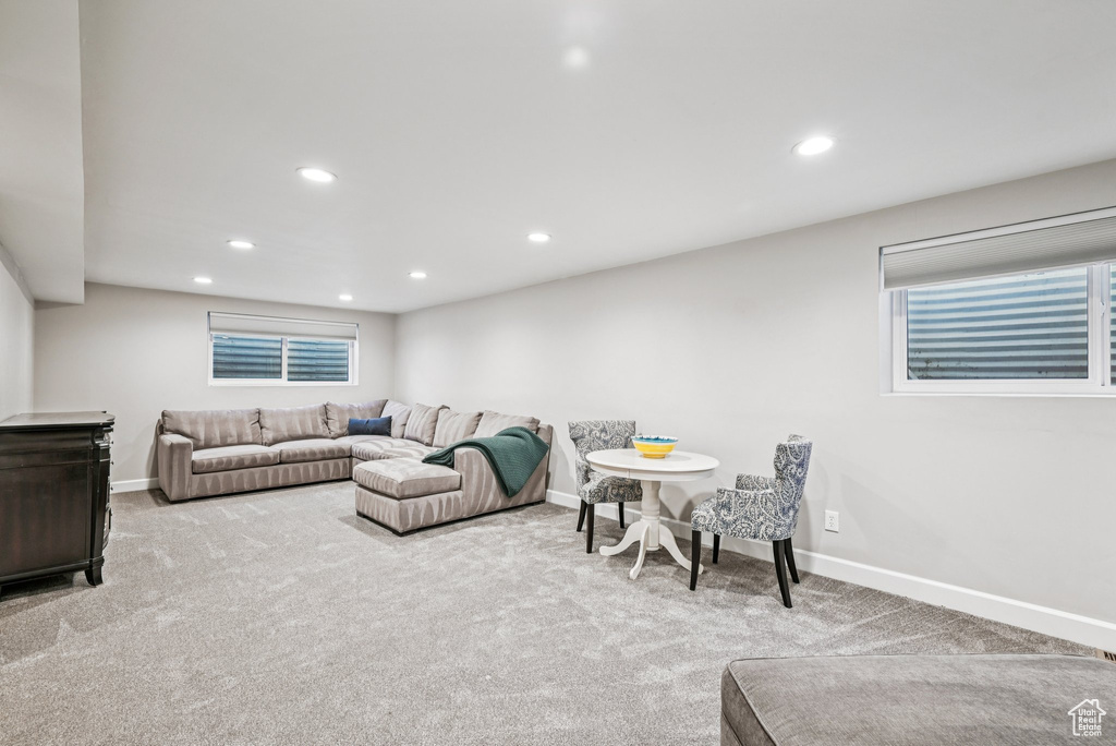 Living room with carpet flooring, baseboards, and recessed lighting