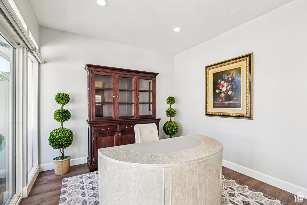 Home office featuring baseboards, recessed lighting, and dark wood-style flooring