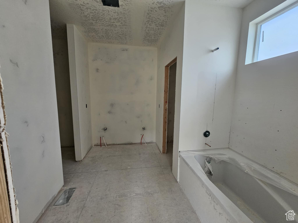 Full bath featuring a bath