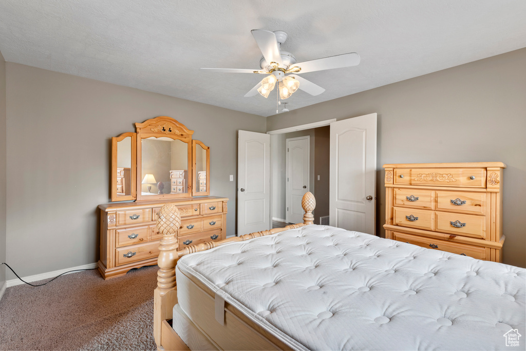 Bedroom featuring carpet flooring and ceiling fan
