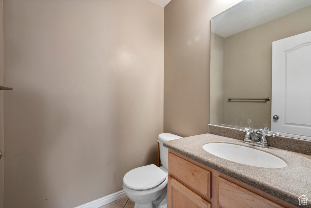 Bathroom with vanity and tile patterned flooring