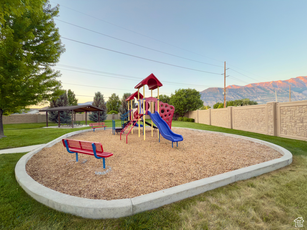 Communal playground featuring a mountain view and a gazebo