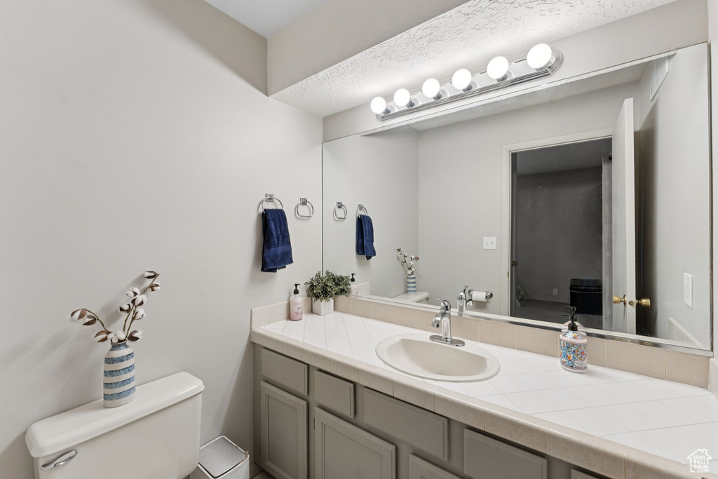 Half bath with toilet and vanity