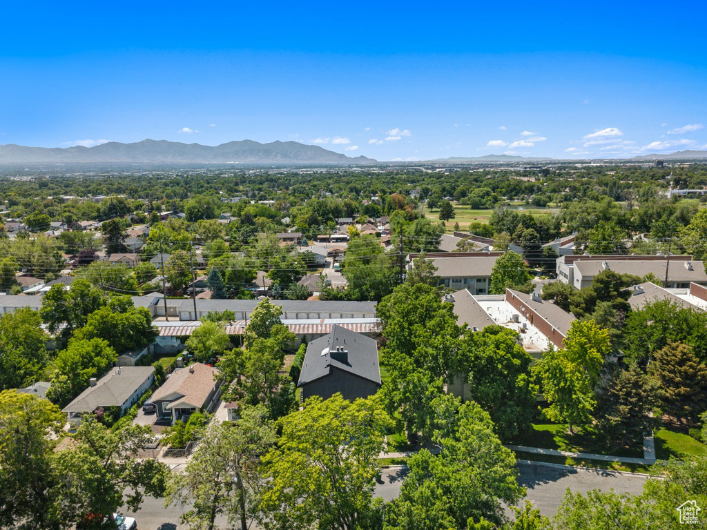 Aerial perspective of suburban area featuring a mountainous background