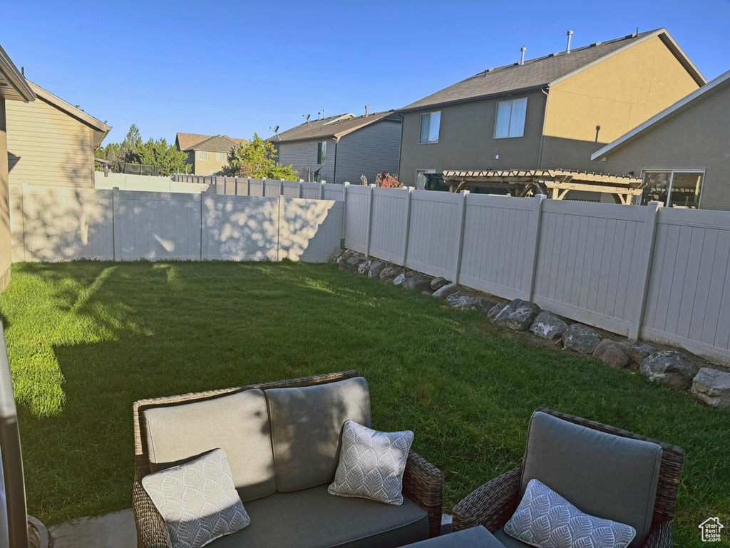 Fenced backyard with a residential view