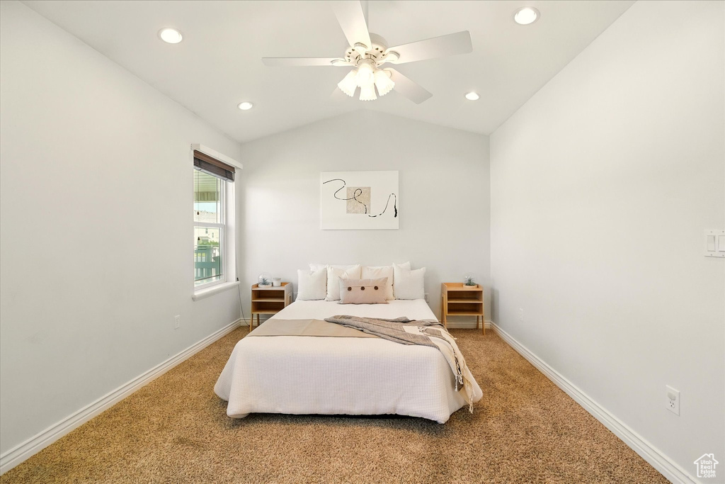 Carpeted bedroom with vaulted ceiling, baseboards, recessed lighting, and ceiling fan