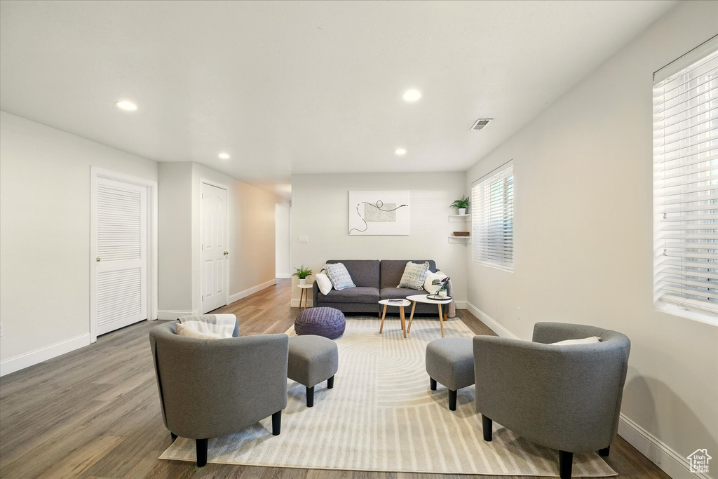 Living area featuring recessed lighting, wood finished floors, and baseboards