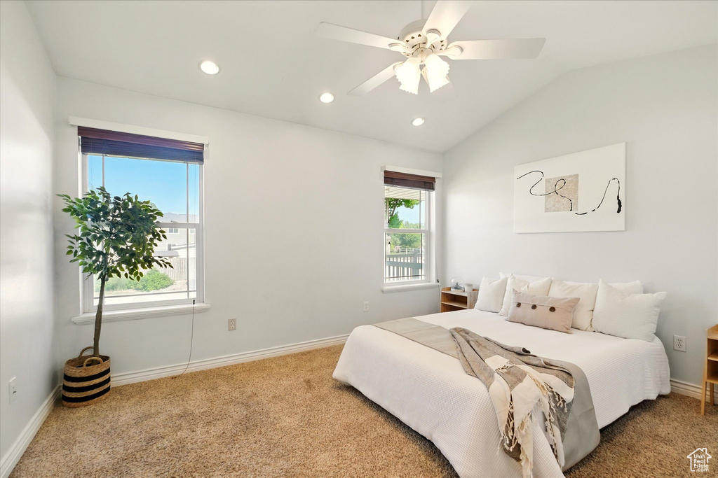 Carpeted bedroom featuring recessed lighting, baseboards, vaulted ceiling, and ceiling fan