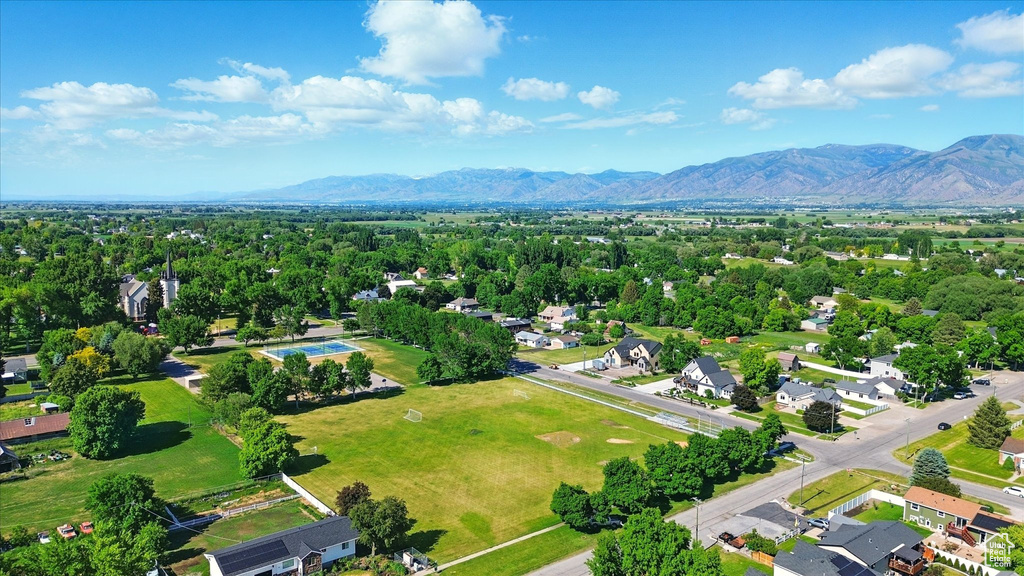 Aerial perspective of suburban area with a mountainous background