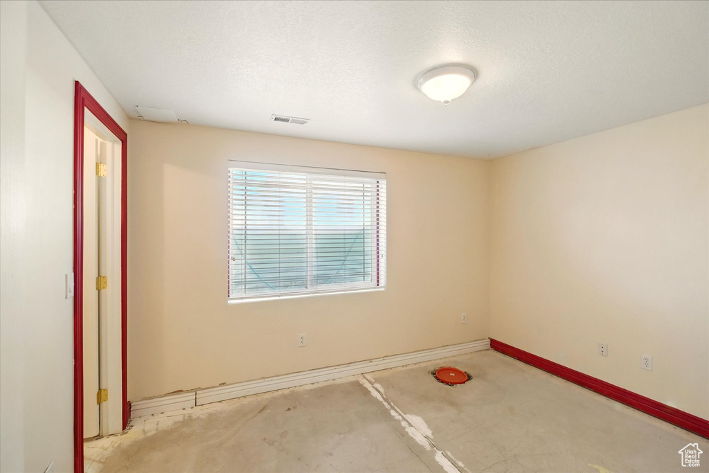 Unfurnished bedroom with baseboards