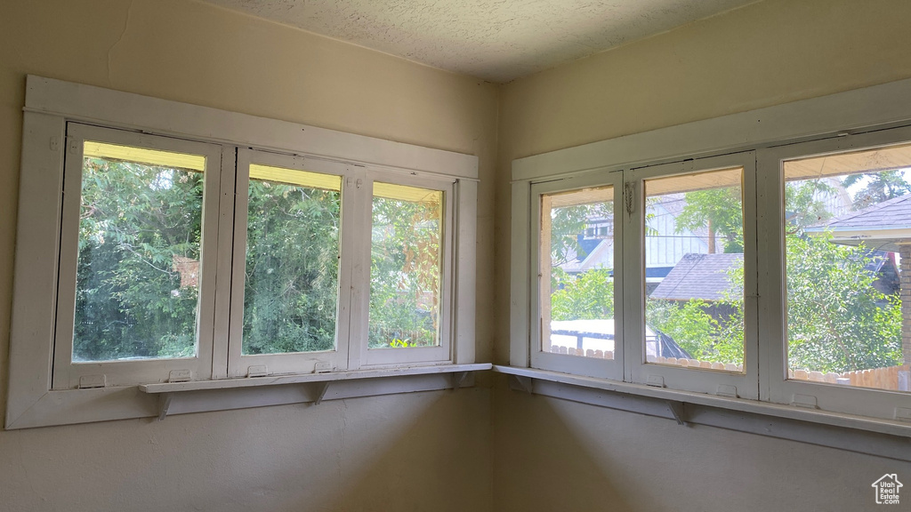 Empty room featuring a textured ceiling