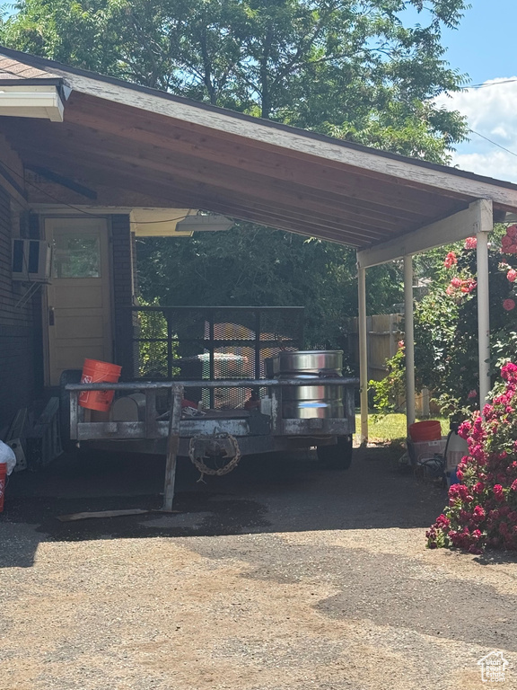 View of vehicle parking with dirt driveway