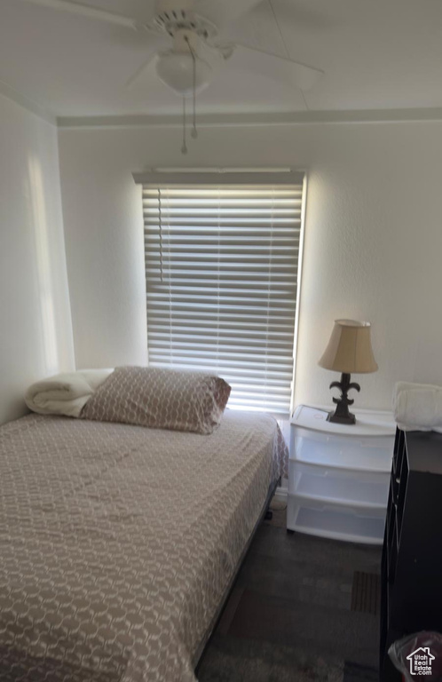 Bedroom featuring wood finished floors and ceiling fan