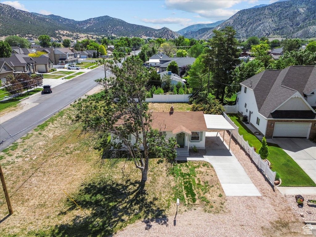 Aerial perspective of suburban area with a mountain backdrop