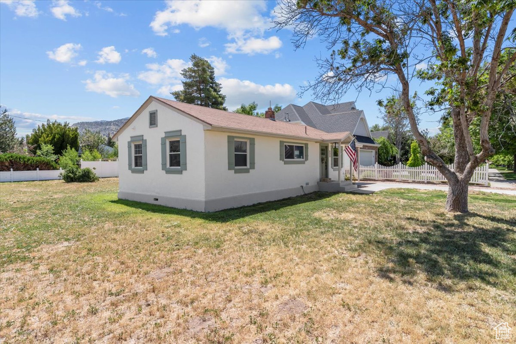 View of front of property featuring stucco siding