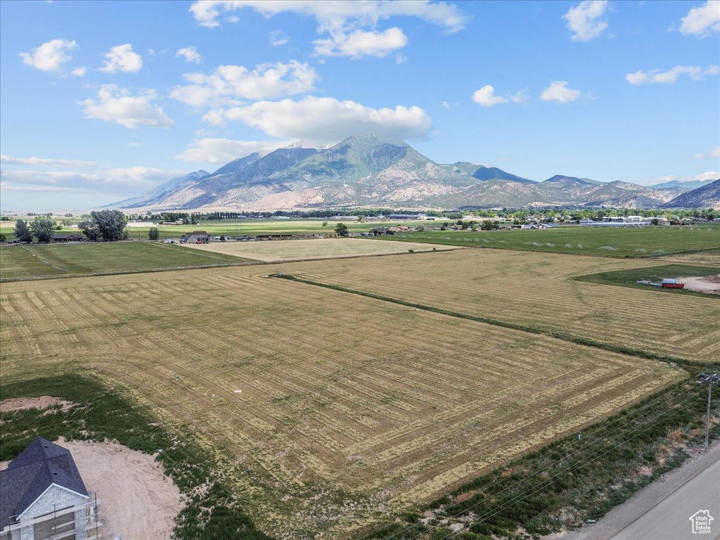 View of mountain backdrop featuring rural landscape and farmland