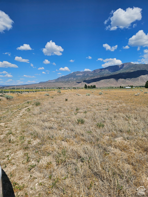 View of mountain backdrop with rural landscape