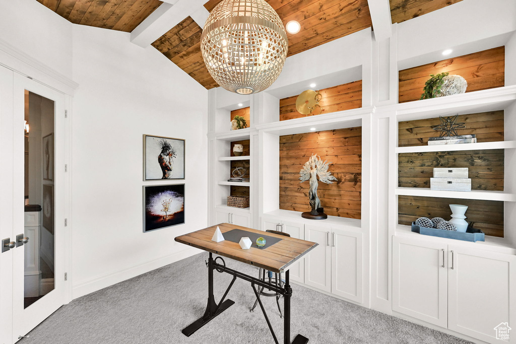 Office space with light colored carpet, wood ceiling, built in features, a chandelier, and baseboards