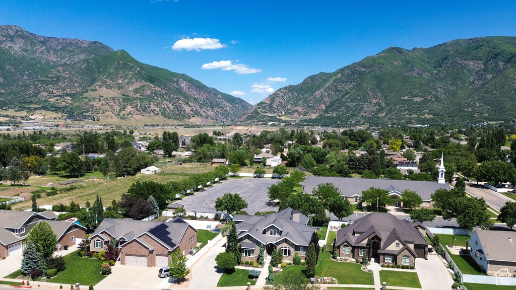 Aerial view of residential area featuring a mountainous background