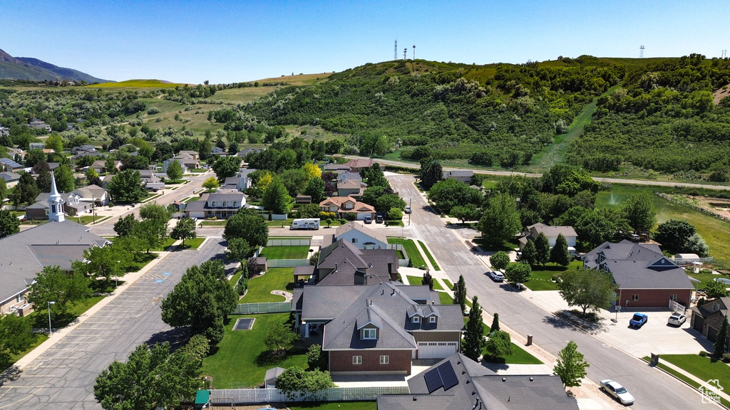 Aerial perspective of suburban area featuring a mountainous background