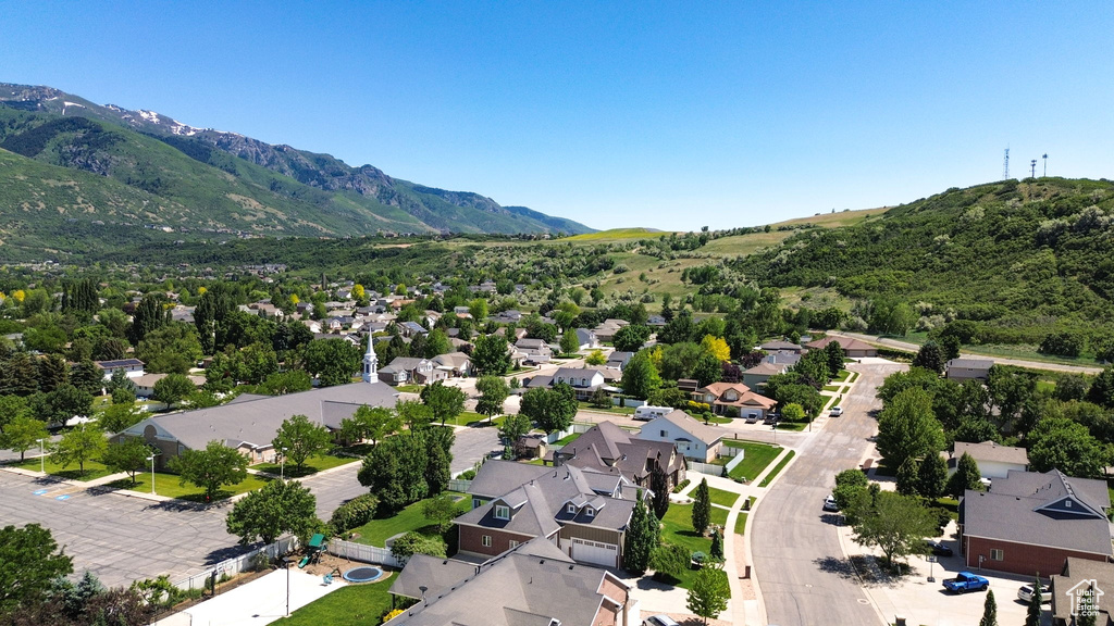 Aerial view of residential area with a mountain backdrop