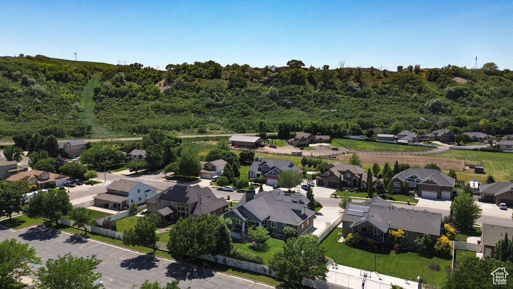 Aerial view of residential area with a heavily wooded area