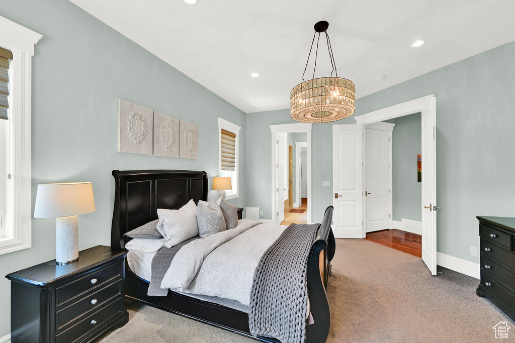Bedroom featuring a chandelier, baseboards, carpet floors, and recessed lighting