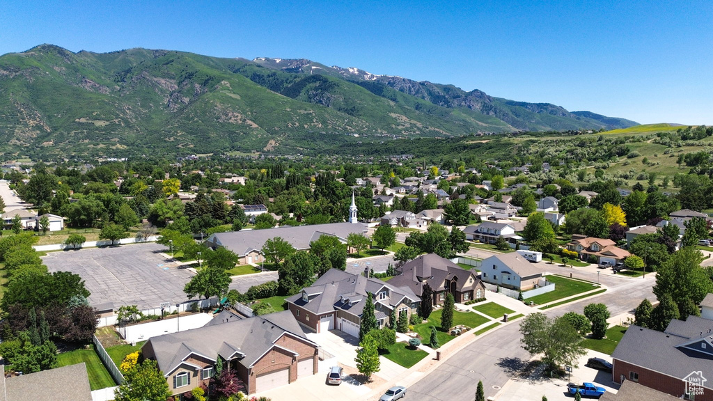 Aerial view of residential area featuring a mountain backdrop