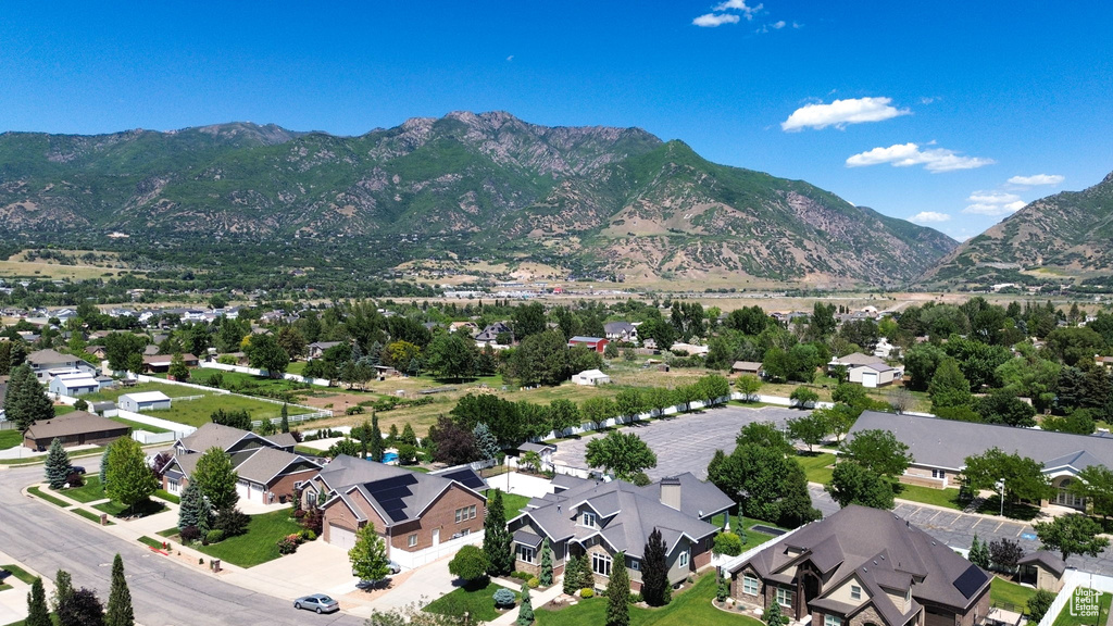 Aerial perspective of suburban area with a mountain backdrop