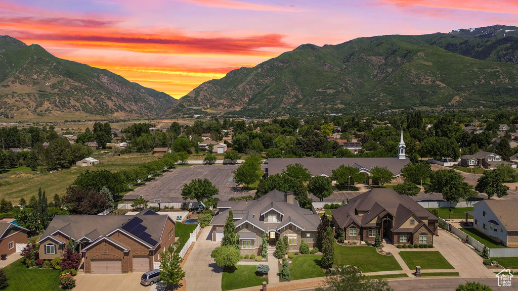 View of mountain backdrop featuring nearby suburban area