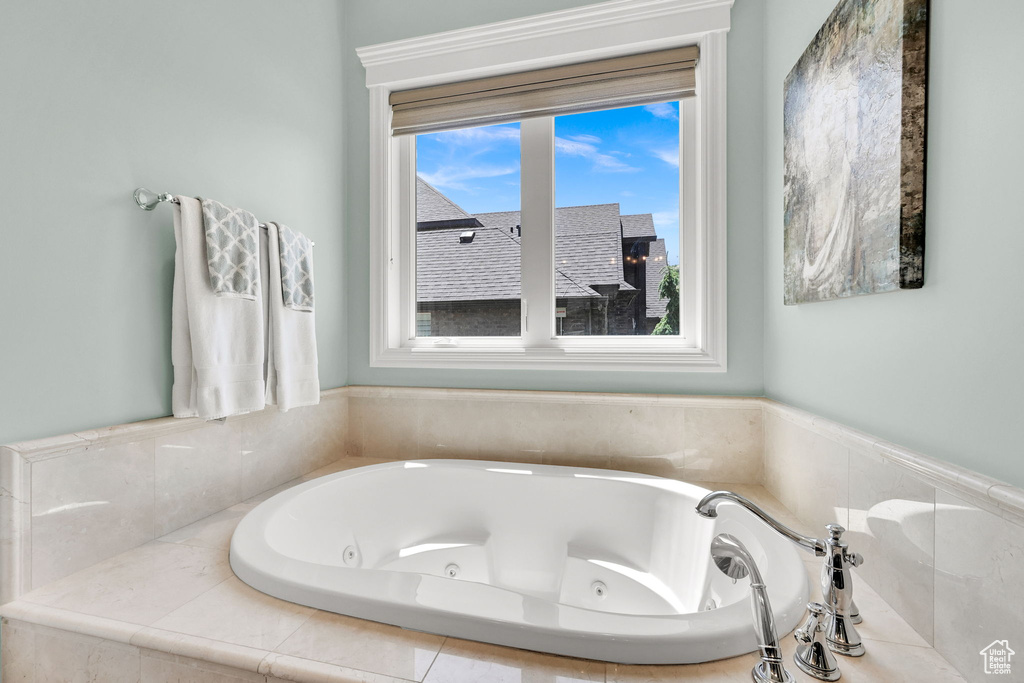 Full bath featuring a whirlpool tub