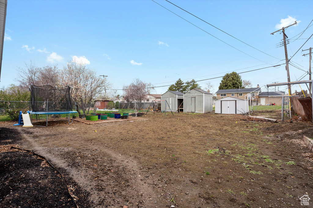 View of yard featuring a trampoline
